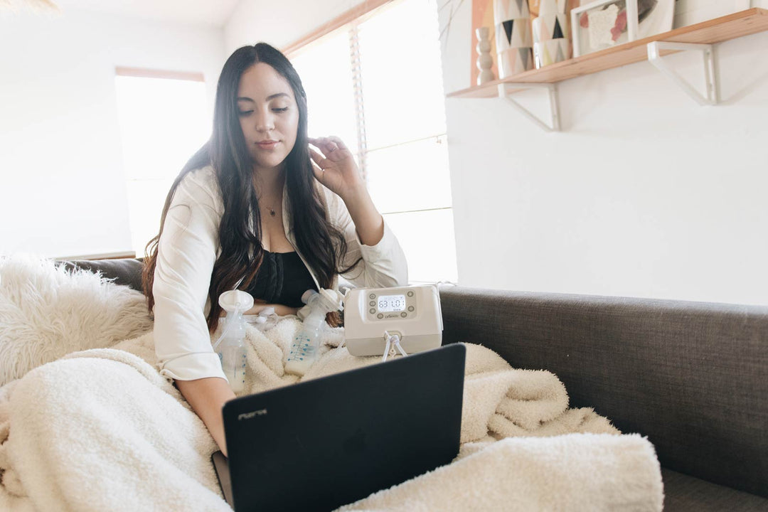 Mother working while using breast pump
