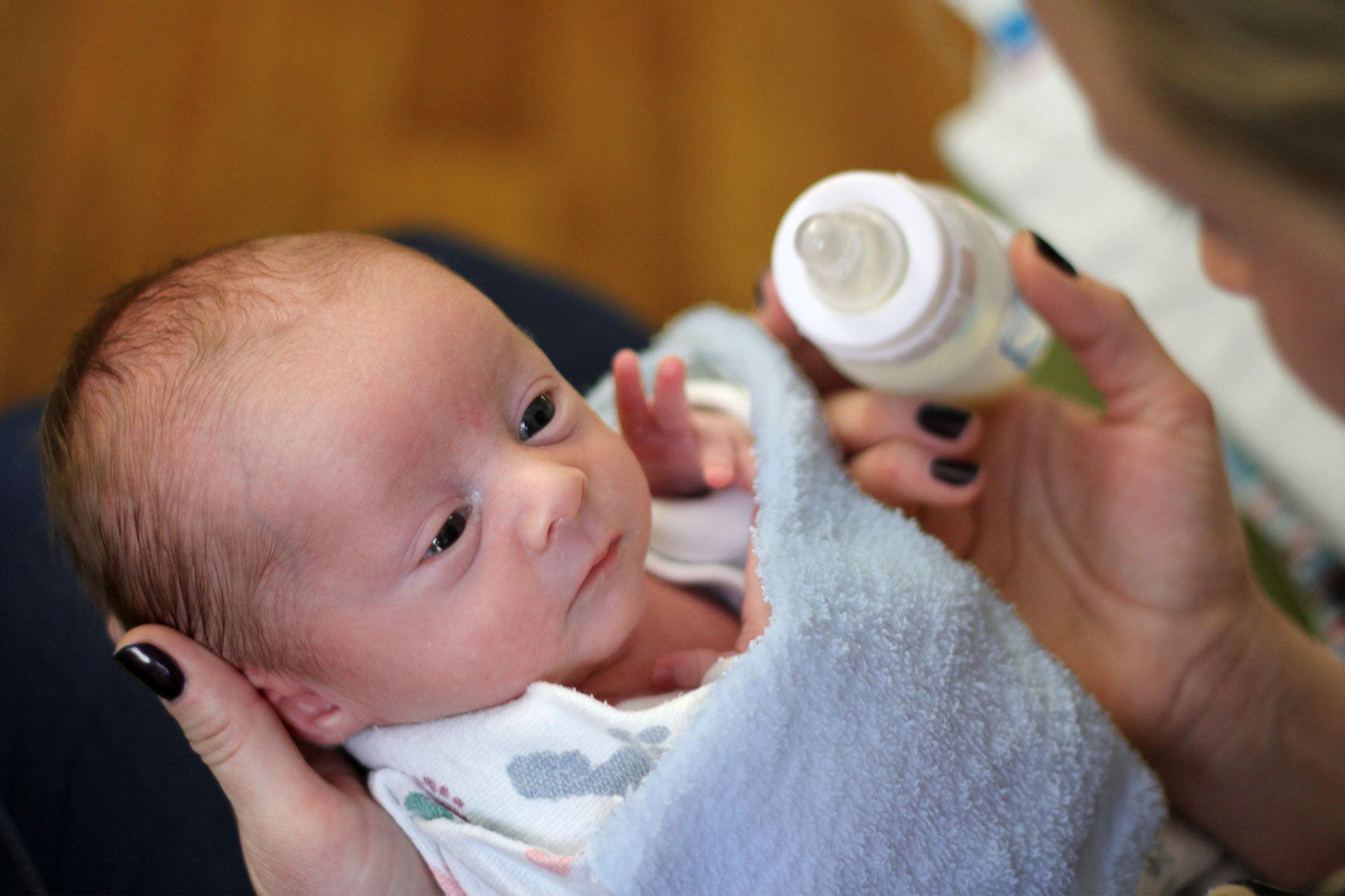 Baby in a hospital feeding from a Dr. Brown's bottle