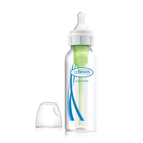 A clear Dr. Brown's baby bottle with a green internal vent system and a white and clear nipple. The bottle cap is placed beside it. The bottle features blue branding text and graphics on its surface.