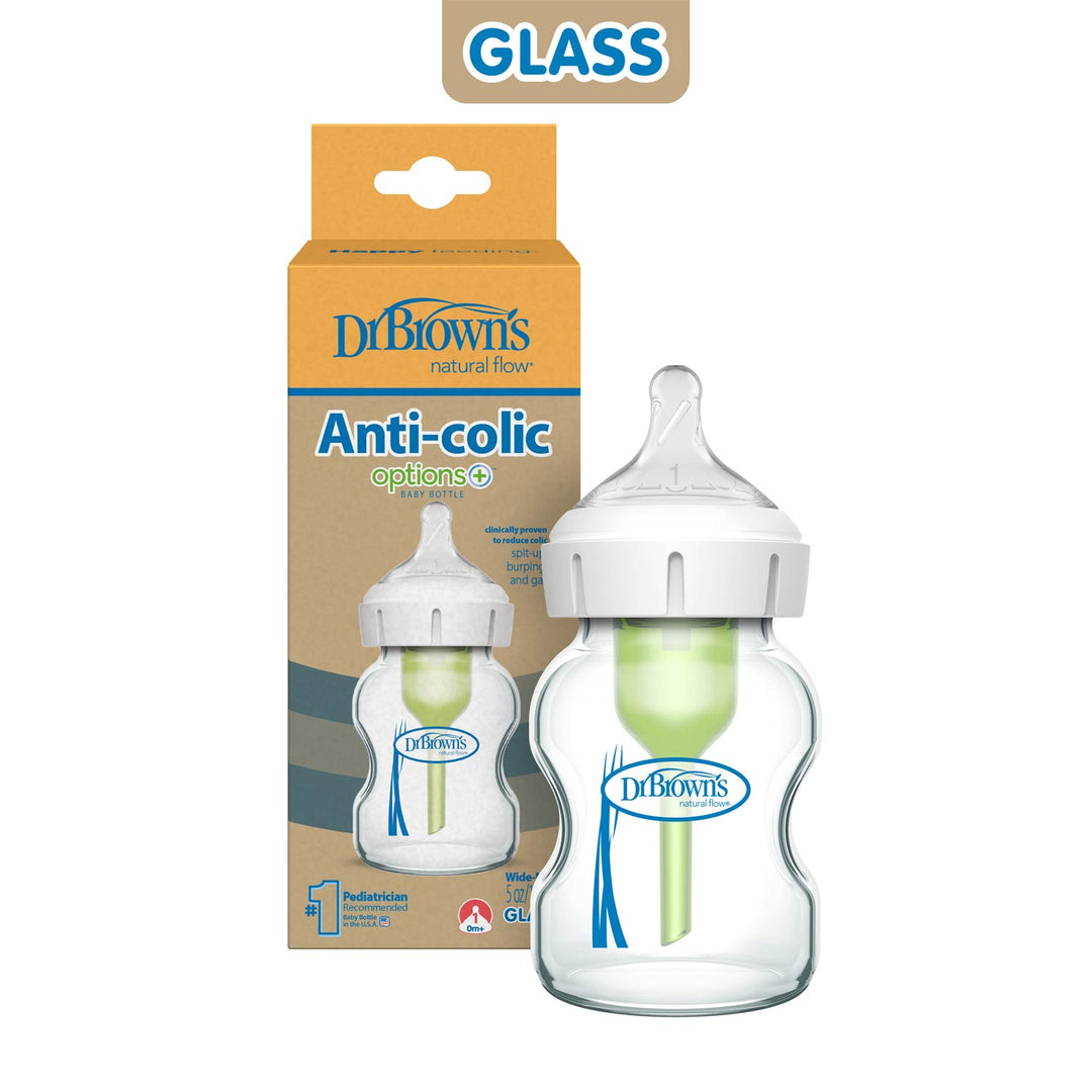 A Dr. Brown’s Natural Flow® Anti-Colic Options+™ Wide-Neck Glass Baby Bottle with Level 1 Slow Flow Nipple is displayed before its packaging, which shows the Dr. Brown’s brand, product details, and "GLASS" at the top.