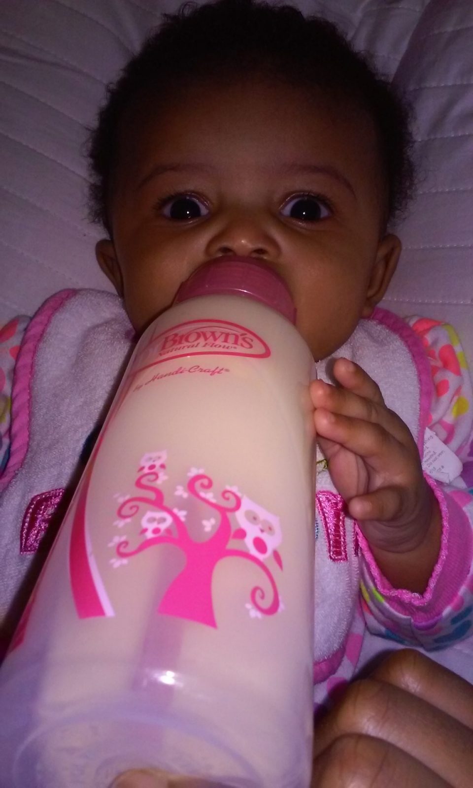 Skylar drinking from Dr. Brown's bottle