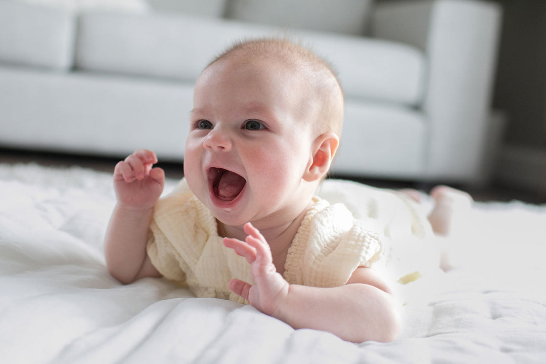 Smiling baby during tummy time