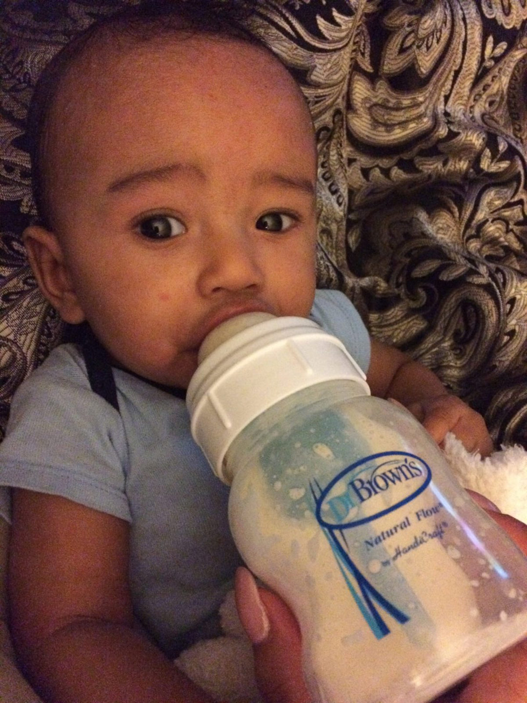 Cayden drinking from Dr. Brown's bottle