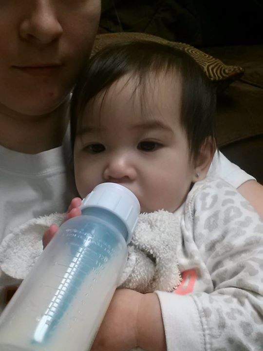 Kora drinking from bottle