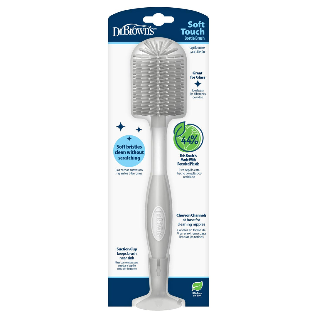 Dr. Brown's Soft Touch Bottle Brush in its original retail packaging, featuring a gray silicone bristle head and a gray handle with a suction cup base.