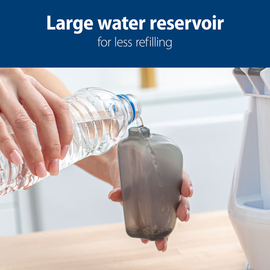 Person pouring water from a bottle into a large water reservoir with text 'Large water reservoir for less refilling' on a blue background.