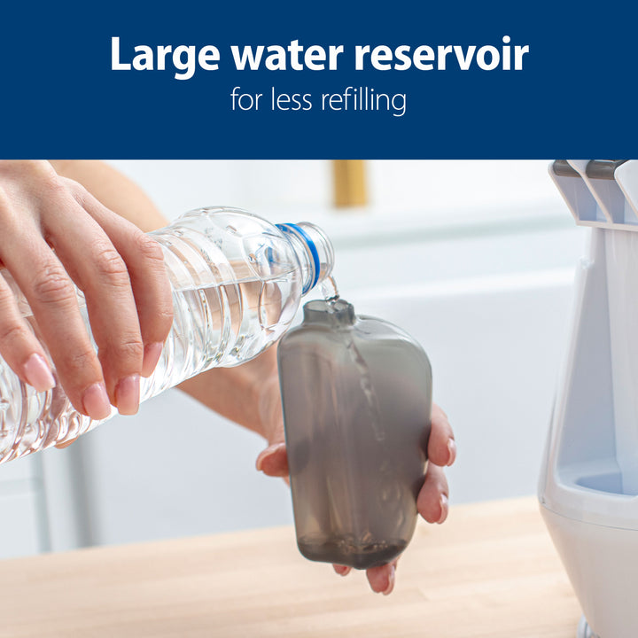 Person pouring water from a bottle into a large water reservoir with text 'Large water reservoir for less refilling' on a blue background.