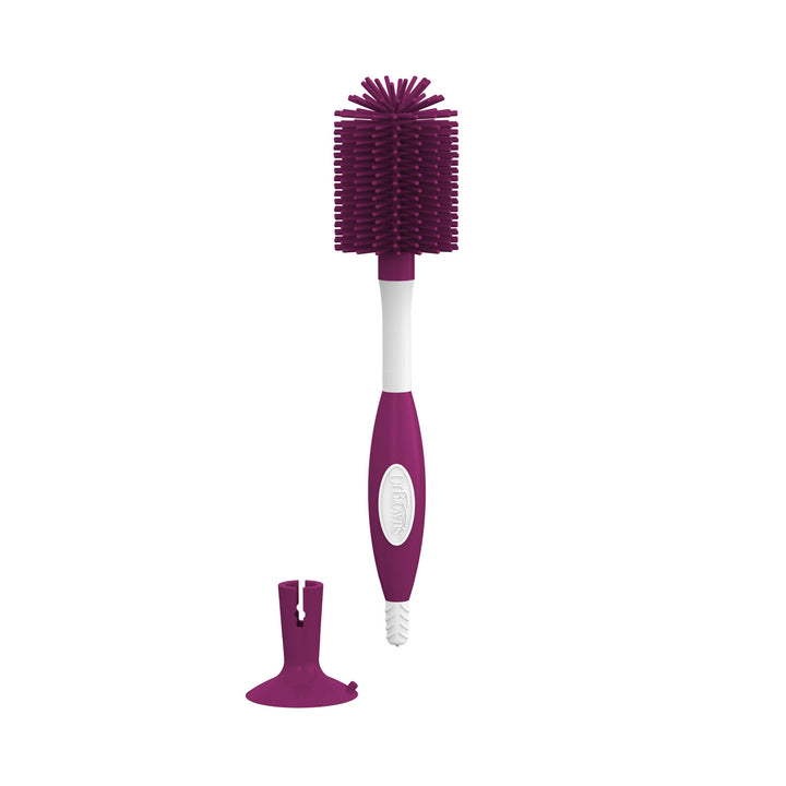 A dark pink and white bottle brush with a separate suction cup accessory