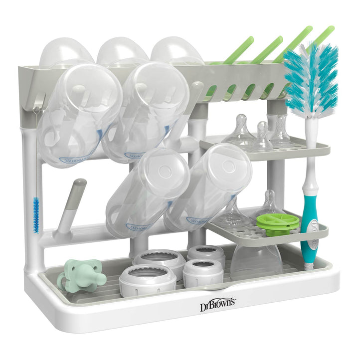 Dr. Brown's gray baby bottle drying rack with cups, bottles, and brushes