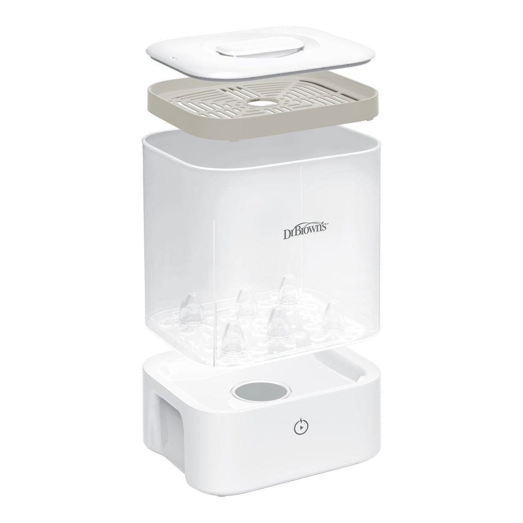 A Dr. Brown's baby bottle sterilizer shown in an exploded view, displaying its white base, clear plastic chamber, beige filter tray, and white lid against a solid white background.
