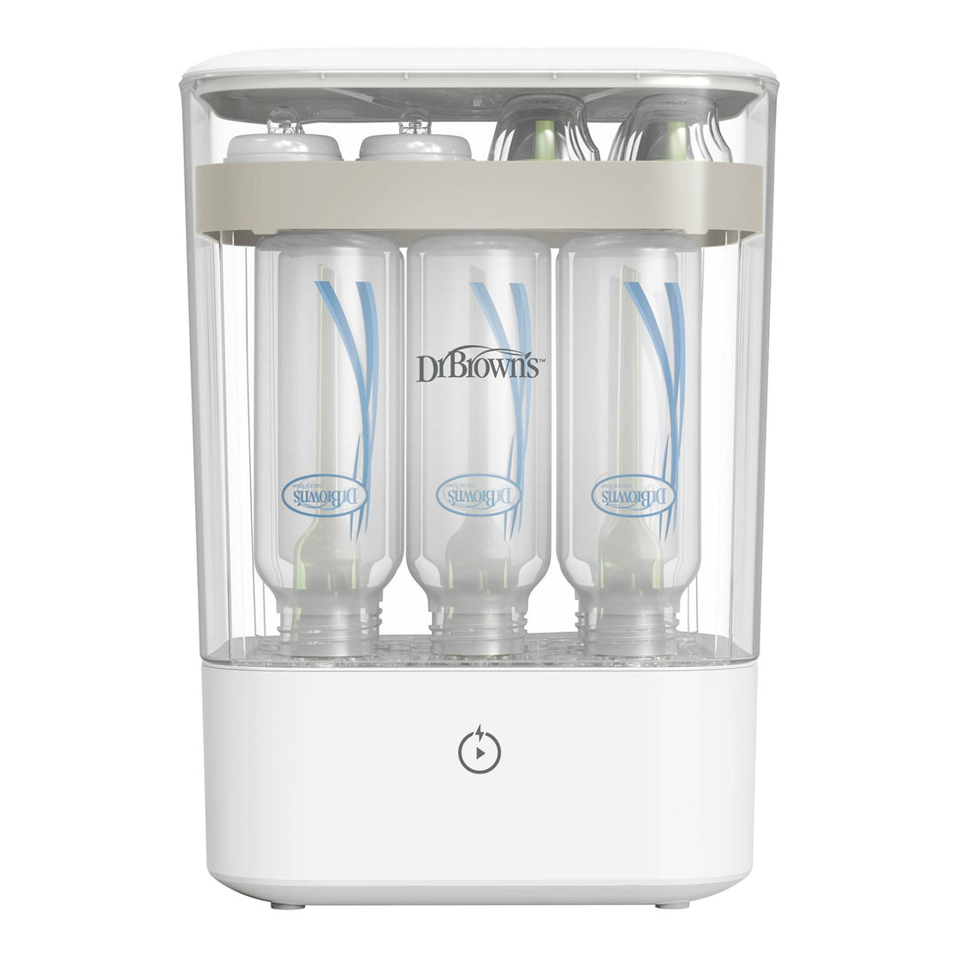 A white and clear sterilizer with three narrow bottles visible through a transparent front panel. The brand name 'Dr. Brown's' is printed, and a power symbol is shown on the front base.