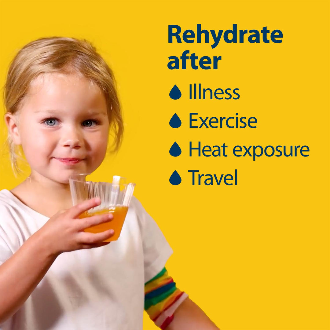 A young child holding a clear plastic drink pouch filled with orange electrolyte against a bright yellow background, with blue text listing reasons to rehydrate after illness, exercise, heat exposure, and travel.