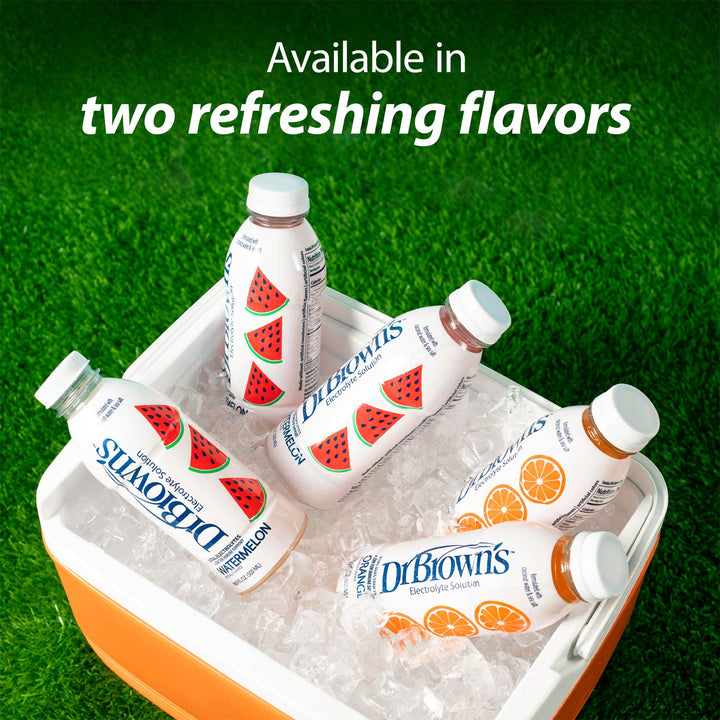 Five Dr. Brown's bottled beverage products arranged in a white and orange cooler filled with ice on a green grass-like background.