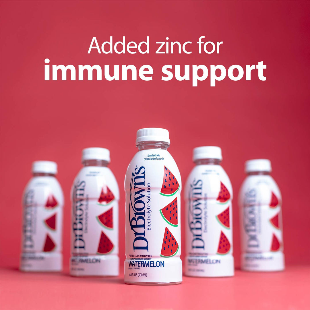 Five Dr. Brown's Watermelon electrolyte solution bottles arranged in a row on a red background, with the center bottle highlighted and white text above reading 'Added zinc for immune support'.