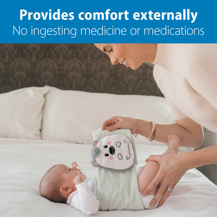 Woman holding a baby and a plush toy, with text about comfort and no ingesting medicine.