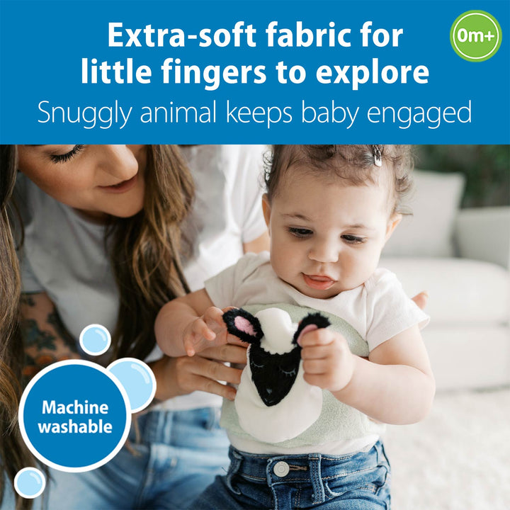 Baby holding a soft toy with text about extra-soft fabric and machine washability.