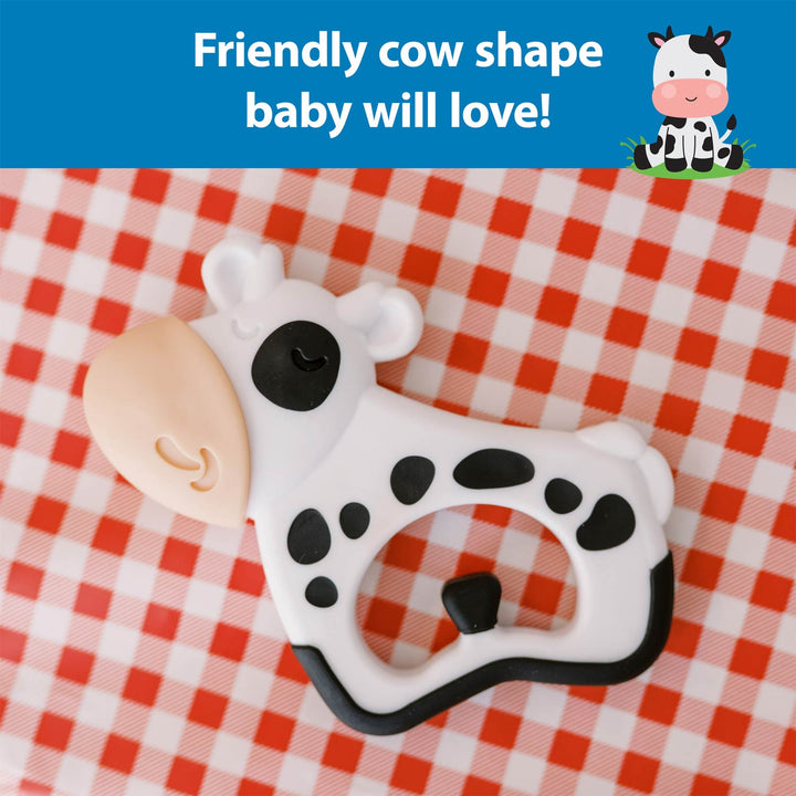 Cow-shaped baby teether on a red and white checkered background with text 'Friendly cow shape baby will love!'.
