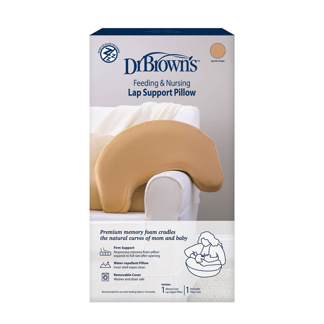 Dr. Brown's™ Feeding & Nursing Lap Support Pillow packaging shows a tan, crescent-shaped pillow on a white chair with product details and an illustration of a parent holding a baby while using the Dr. Brown's pillow.