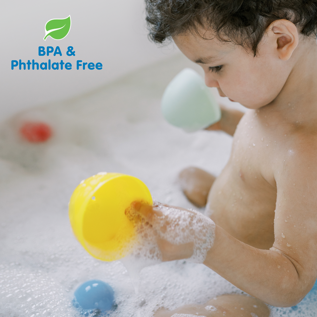 A toddler plays with Dr. Brown’s™ CleanUp™ Float & Hatch Dino Eggs bath toys in bubbly water. The image displays "BPA & Phthalate Free" beside a green leaf icon. Brand: Dr. Brown's.