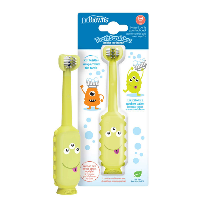 Two yellow Dr. Brown's™ ToothScrubber™ toddler toothbrushes, ages 1–4, feature soft triple-sided brush heads and smiling faces. Packaging shows playful graphics and product info in English and French.