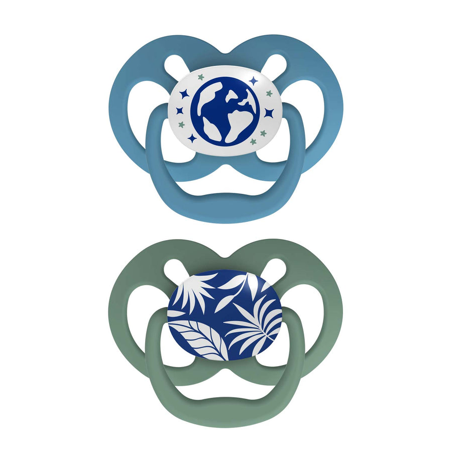 Dr. Brown's™ Advantage™ Glow-in-the-Dark Pacifiers 2 Count set includes one light blue pacifier with glowing globe and stars design and another green pacifier with a blue leaf pattern.