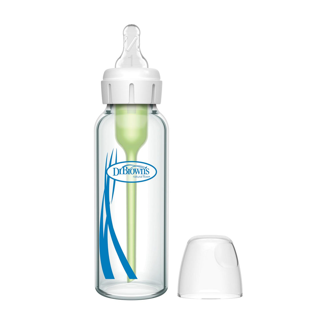 A Dr. Brown's Natural Flow® Anti-Colic Options+™ Narrow Glass Baby Bottle with a Level 1 Slow Flow Nipple, green vent system, white cap, and transparent cover is shown against a plain white background.