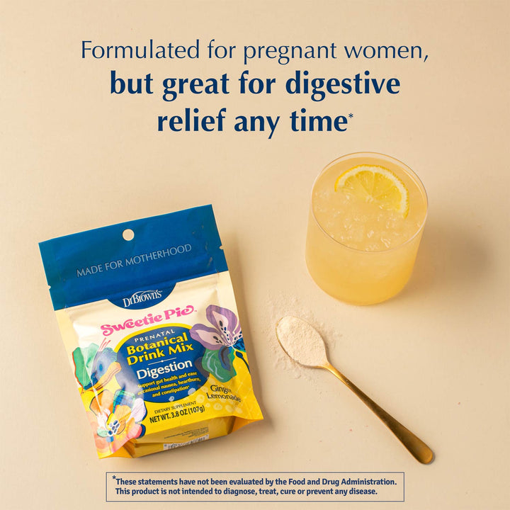 Dr. Brown's Sweetie Pie herbal digestion drink mix pouch shown next to a glass of yellow iced drink with a lemon slice and a gold spoon with powder, on a beige background with promotional text.