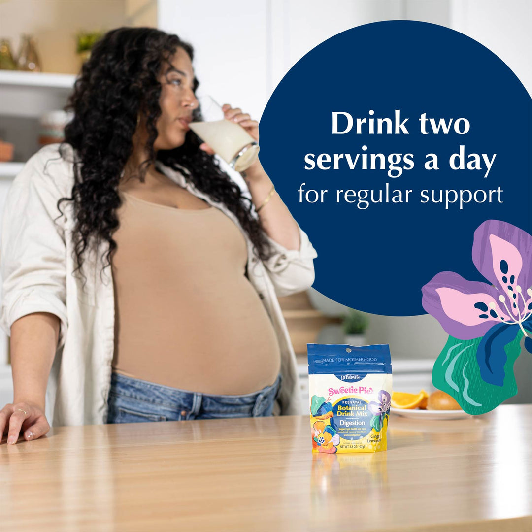 A pregnant woman drinking Ginger Lemonade flavored drink for digestion in a kitchen setting, with a package of Botanical Drink Mix on the counter and a large blue text bubble that reads 'Drink two servings a day for regular support'.