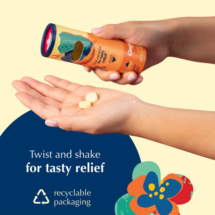 A person's hands are shown holding an orange cylindrical tube of Nausea Candies and shaking it, with a few tablets falling into the other hand. The background is a solid pale yellow with a dark blue graphic overlay at the bottom left containing the text 'Twist and shake for tasty relief' and 'recyclable packaging'.