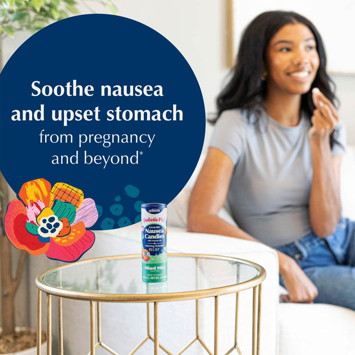 A bottle of Sweetie Pie Mixed Mint Nausea Candies sits on a round glass-top side table in a living room setting, with a woman sitting on a couch in the background. A large dark blue graphic overlay on the left features white text reading 'Soothe nausea and upset stomach from pregnancy and beyond' along with colorful floral illustrations.