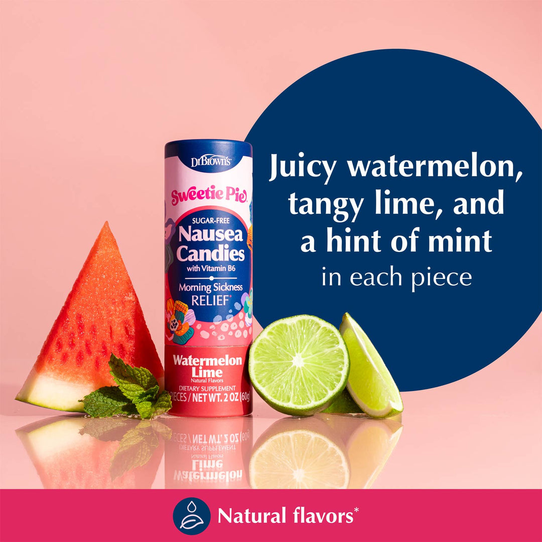 A Sweetie Pie brand nausea relief candy canister labeled Watermelon Lime stands on a pink reflective surface with a watermelon slice, lime wedges, and mint leaves beside it. A large dark blue circle contains white text describing the flavor notes.