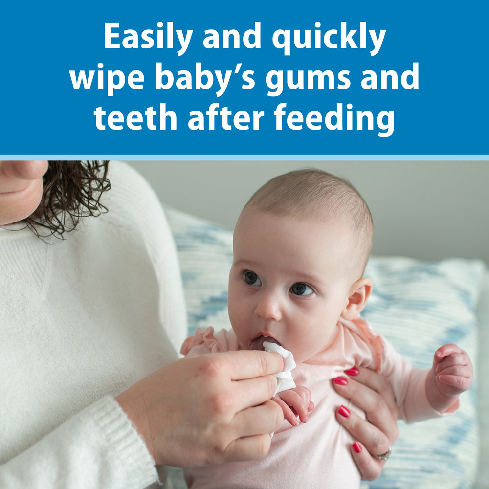 Baby being fed with a Dr. Brown's Tooth and Gum Wipe, with text about easily and quickly wiping baby's gums and teeth after feeding.