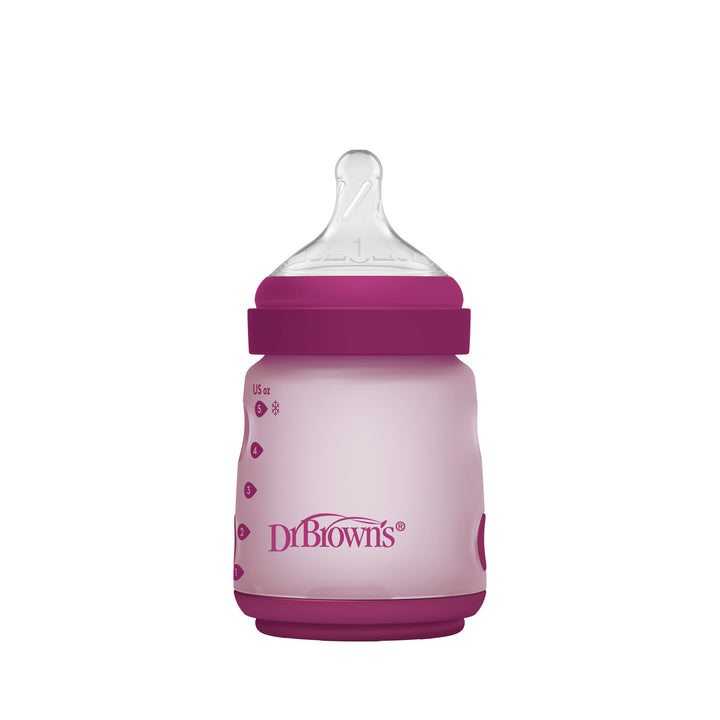 Pink Dr. Brown's silicone wide-neck baby bottle with purple cap