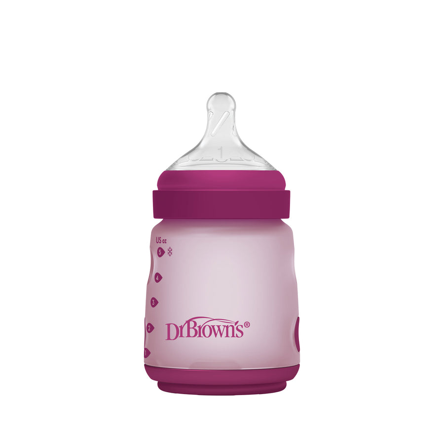 Pink Dr. Brown's silicone wide-neck baby bottle with purple cap
