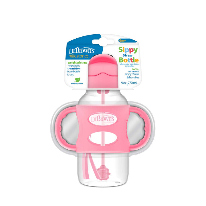 The Dr. Brown’s™ Milestones™ Wide-Neck Sippy Straw Bottle, designed for babies 6 months and older, features a silicone weighted straw, two pink handles, and a 9 oz capacity, helping your child transition from bottle to cup by encouraging independent drinking skills.