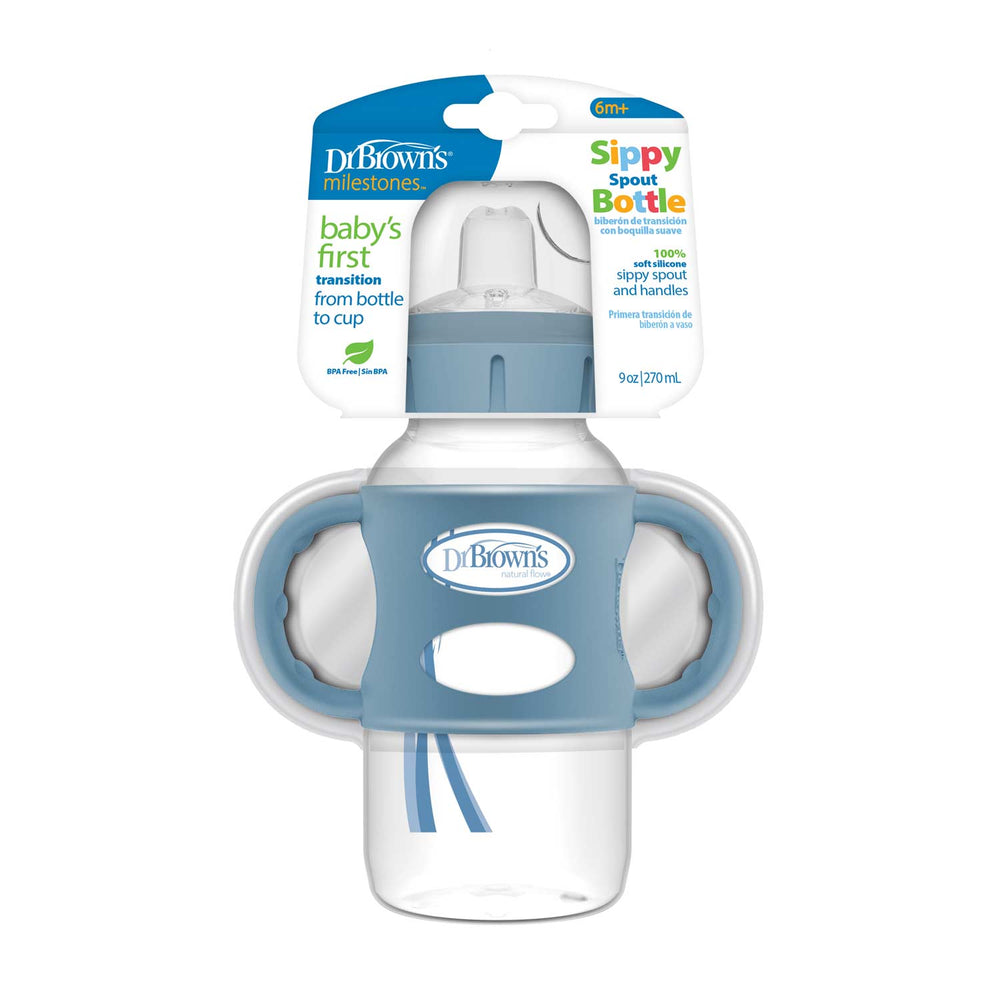 A Dr. Brown's® Milestones™ Wide-Neck Sippy Spout Bottle with Silicone Handles, 9 oz/270 ml, designed for ages 6 months+, is shown helping transition from bottle to cup while its benefits are highlighted on the packaging.