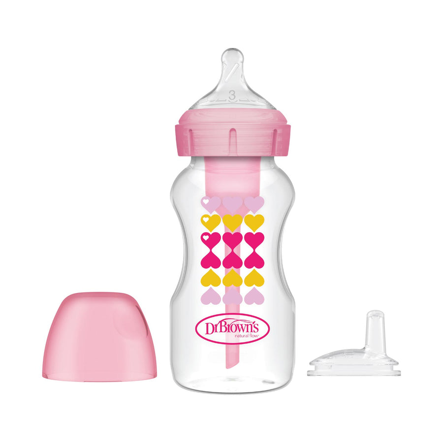 Dr. Brown's Natural Flow® Anti-Colic Options+™ Sippy Bottle Starter Kit is a transparent bottle with pink/yellow hearts, a pink lid, and advanced anti-colic vent. It includes a pink cap and an extra natural flow nipple set.