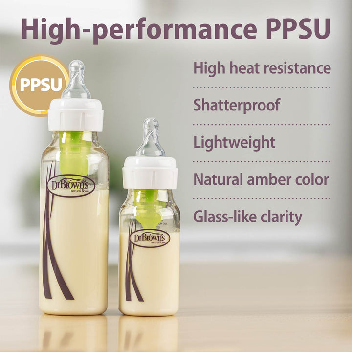 Two Dr. Brown's PPSU baby bottles with white caps and green inner liners, shown on a light surface with promotional text highlighting high heat resistance, shatterproof quality, lightweight design, natural amber color, and glass-like clarity.