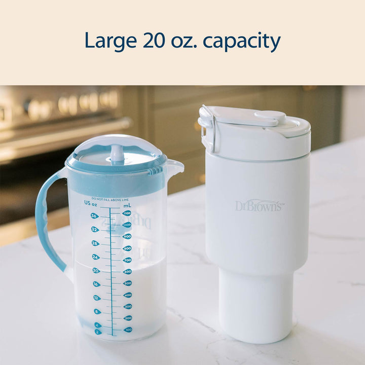 Dr. Brown's breast milk and formula chiller with a measuring cup on a kitchen counter.