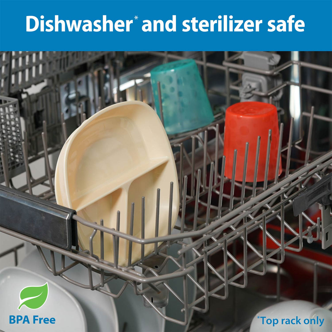 Close-up of a dishwasher rack with an ecru No-Slip Divided Suction Plate, a teal cup, and an orange cup inside, plus text reading 'Dishwasher and sterilizer safe', 'BPA Free', and 'Top rack only'.