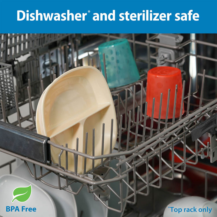 Close-up of a dishwasher rack with an ecru No-Slip Divided Suction Plate, a teal cup, and an orange cup inside, plus text reading 'Dishwasher and sterilizer safe', 'BPA Free', and 'Top rack only'.