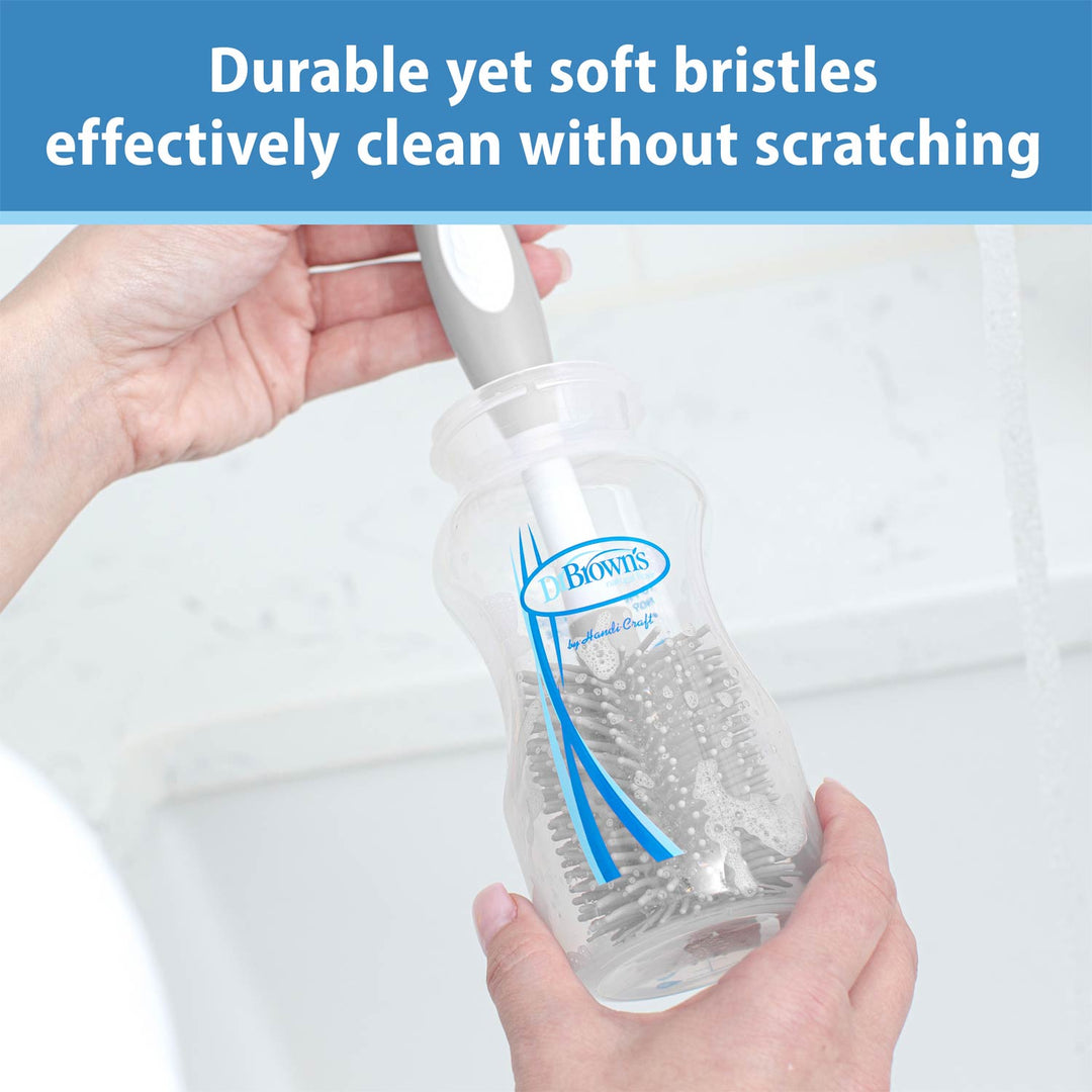 Gray Soft Touch Bottle Brush and bottle held by a person with text about brush durability and cleaning effectiveness.