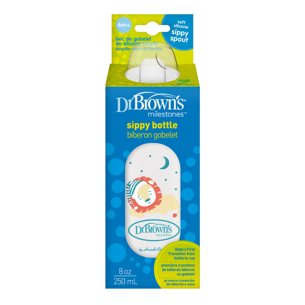 The packaging of Dr. Brown's® Milestones™ Narrow Sippy Bottle, designed for babies 6 months and older, features a charming blue polka dot pattern with a playful lion illustration and an image of a baby. This 8 oz (250 mL) sippy bottle includes a sippy spout ideal for little ones.