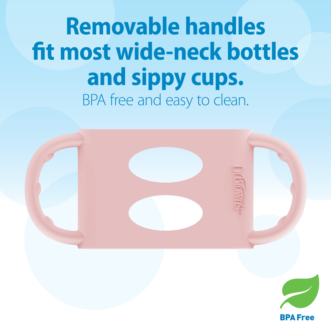 Displayed is a Dr. Brown’s® Milestones™ Wide-Neck Silicone Handle in pink, designed for wide-neck bottles and sippy cups. The accompanying text states: "This removable handle fits most Dr. Brown's Wide-Neck Bottles and sippy cups, aiding the development of independent drinking skills. It is BPA free and easy to clean," with a BPA Free logo featured in the corner.