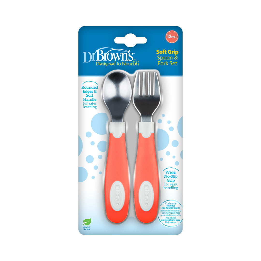 Packaging of the Dr. Brown’s™ Designed to Nourish™ Soft-Grip Spoon and Fork by Dr. Brown's, with a stainless steel fork and spoon suitable for ages 12 months and up. These utensils include orange handles with rounded edges for easy handling and safe learning.