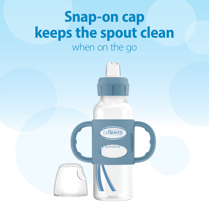 A Dr. Brown’s® Milestones™ Narrow Sippy Spout Bottle with Silicone Handles, featuring a blue snap-on cap and removable sippy spout, is showcased. Text above says, "Snap-on cap keeps the spout clean when on the go." The background displays a gradient of light blue circles.