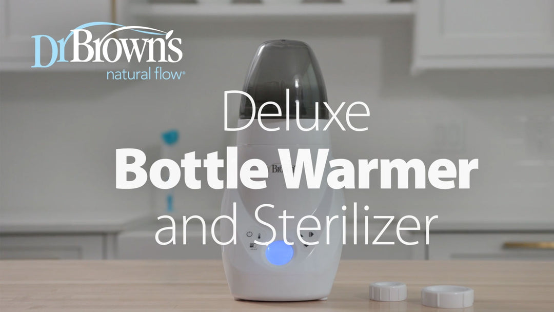 Dr Brown's Deluxe Bottle Warmer and Sterilizer on a kitchen counter with 'Dr Brown's' branding.