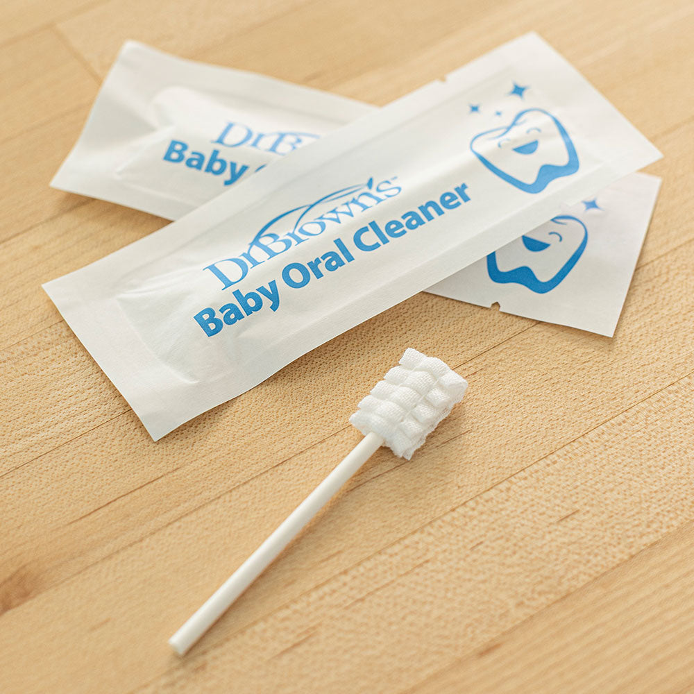 Dr Brown's Baby Oral Cleaner with packaging on a wooden surface