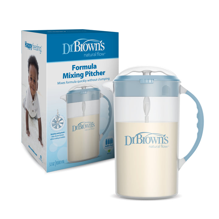 An image of Dr. Brown's Natural Flow® Formula Mixing Pitcher next to its packaging, displaying a smiling baby and the product name. The transparent pitcher, crafted to minimize gas, contains formula and features a blue handle and lid, ideal for use with baby bottles.