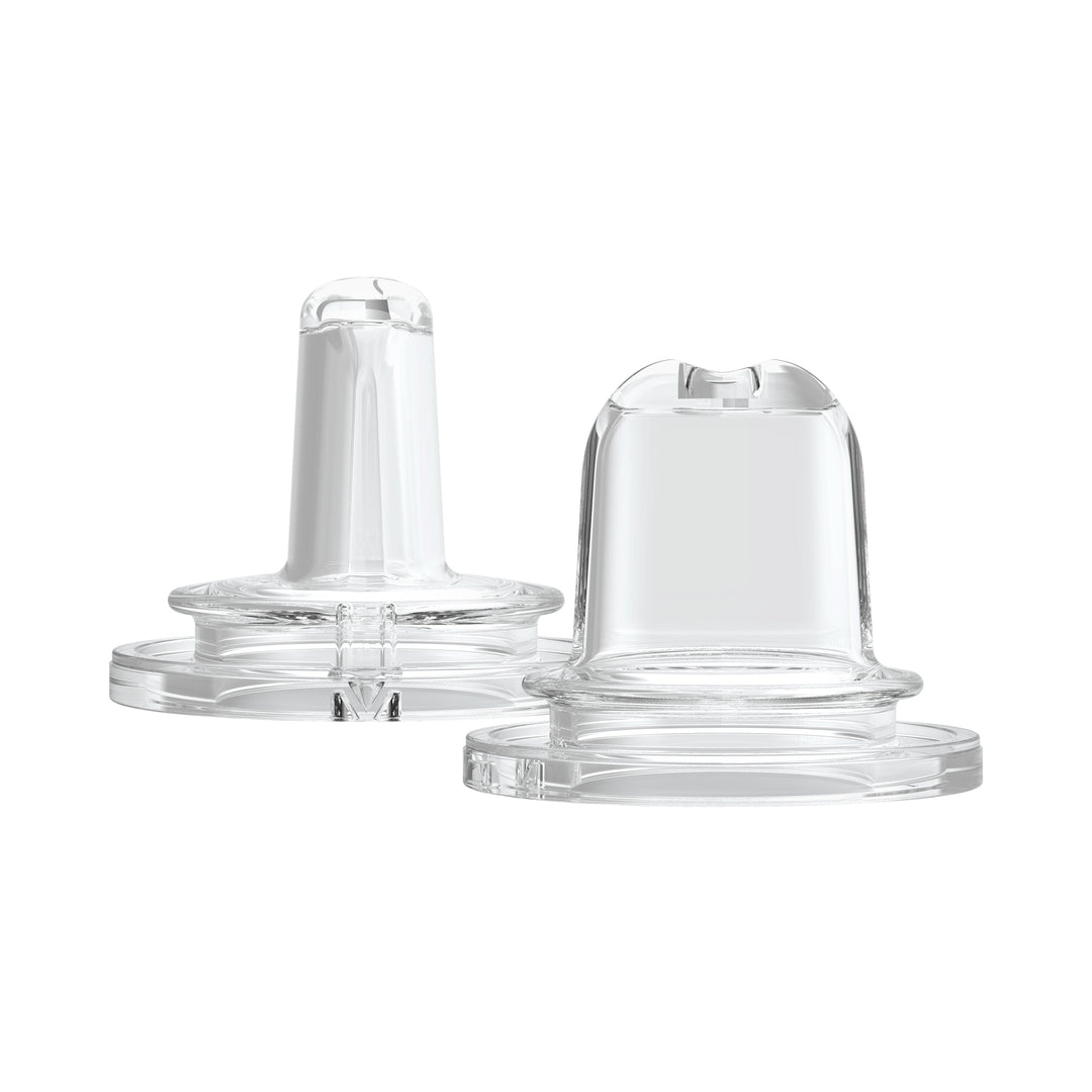 Two Dr. Brown's® Milestones™ Options+™ sippy spouts are displayed side by side on a white background. Made from soft 100% silicone, one is shown with the spout visible from the side and the other from a front angle, highlighting their design for easy drinking.